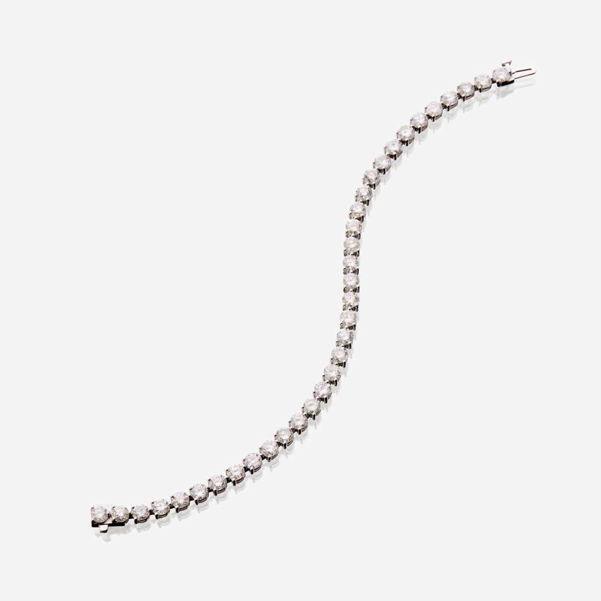 A diamond and eighteen karat white gold bracelet