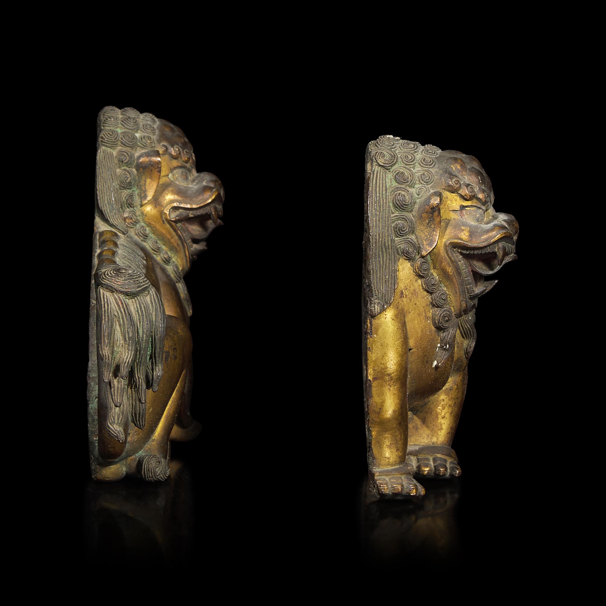 A Pair of Chinese Gilt Bronze Lion Mounts, 17th/18th Century 清中期 鎏金銅獅一對