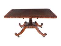 A Regency Calamander or Rosewood and Mahogany Leather-Inset Tilt-Top Table