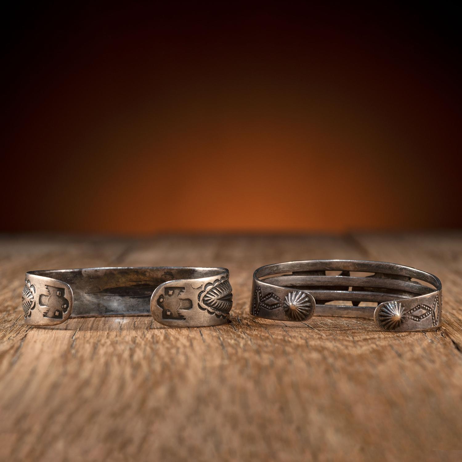 Pair of Navajo Silver Cuff Bracelets, with Thunderbirds