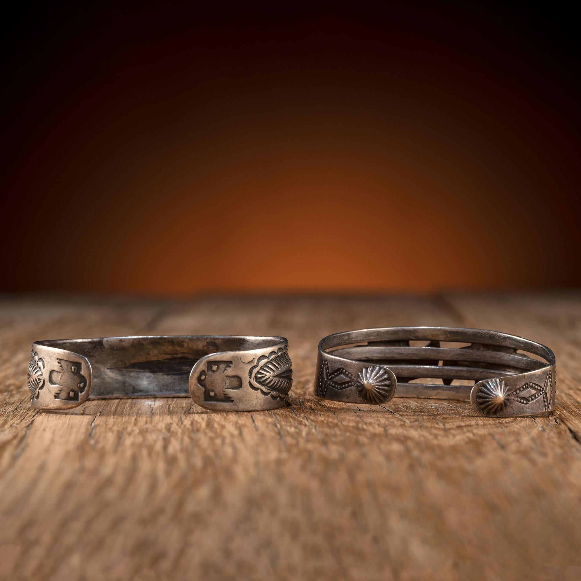 Pair of Navajo Silver Cuff Bracelets, with Thunderbirds