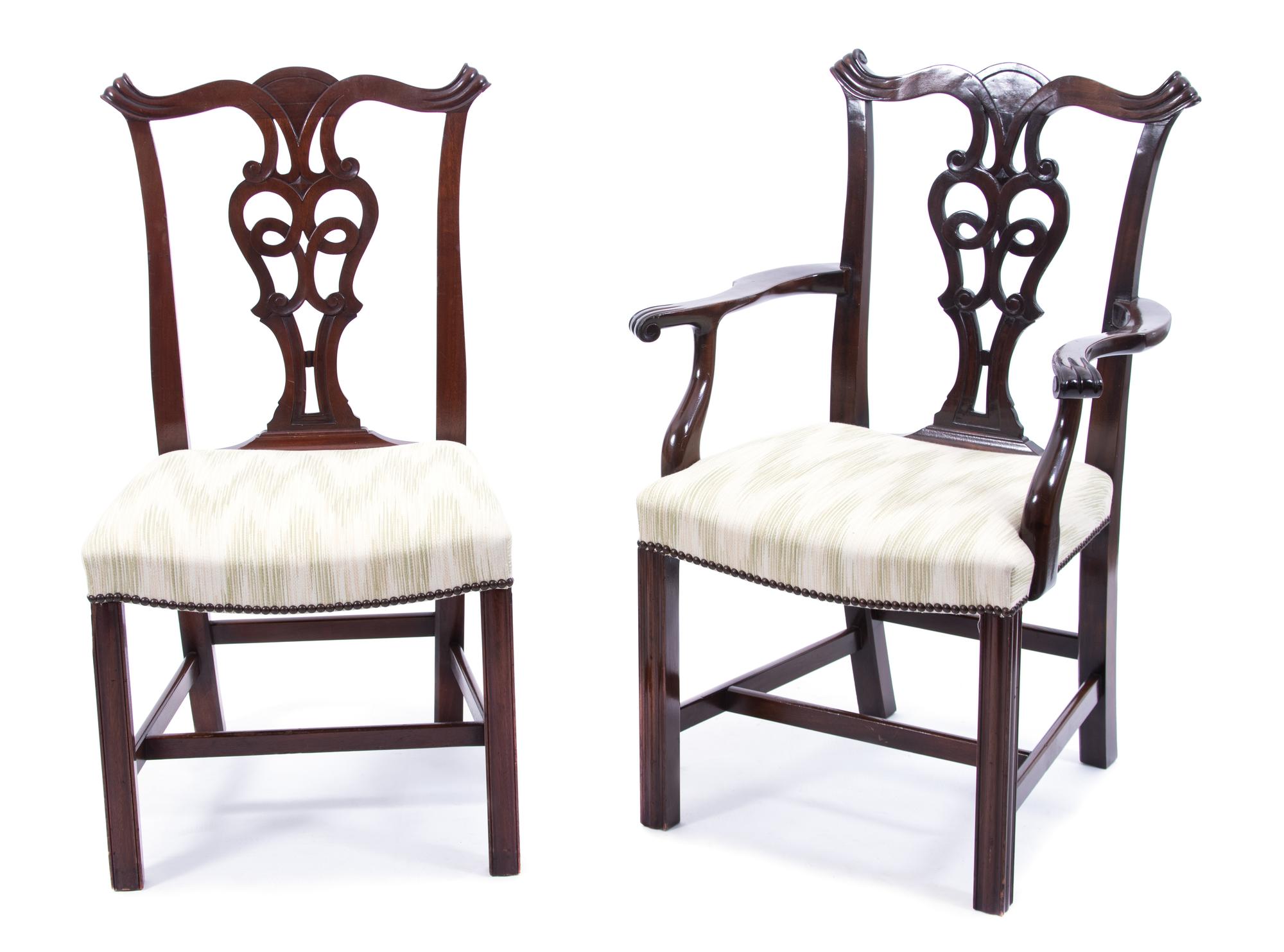 A Set of Twelve Hepplewhite Style Carved Mahogany Dining Chairs Height 37 1/2 inches. — 20TH CENTURY