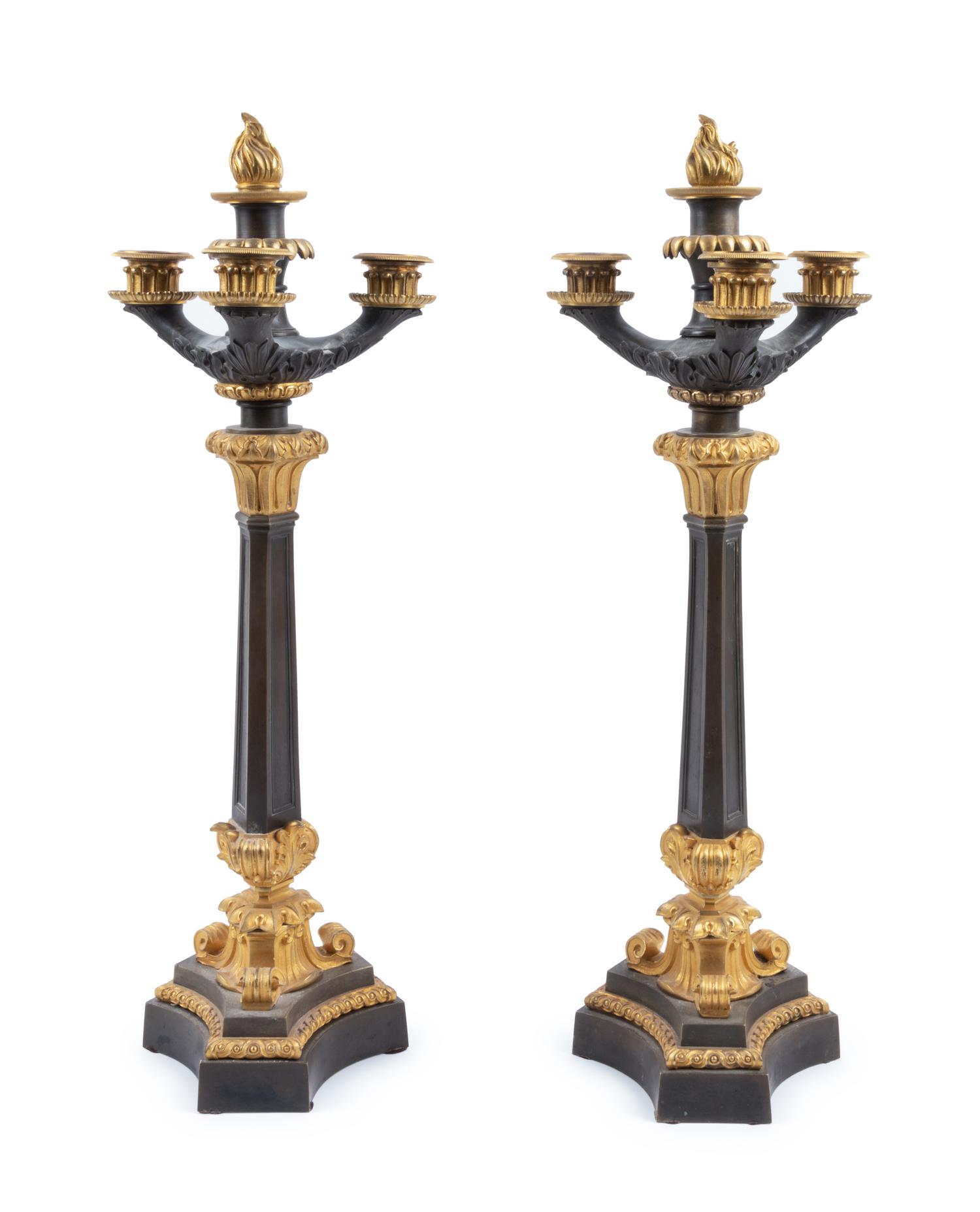 A Pair of Charles X Style Gilt and Patinated Bronze Four-Light Candelabra