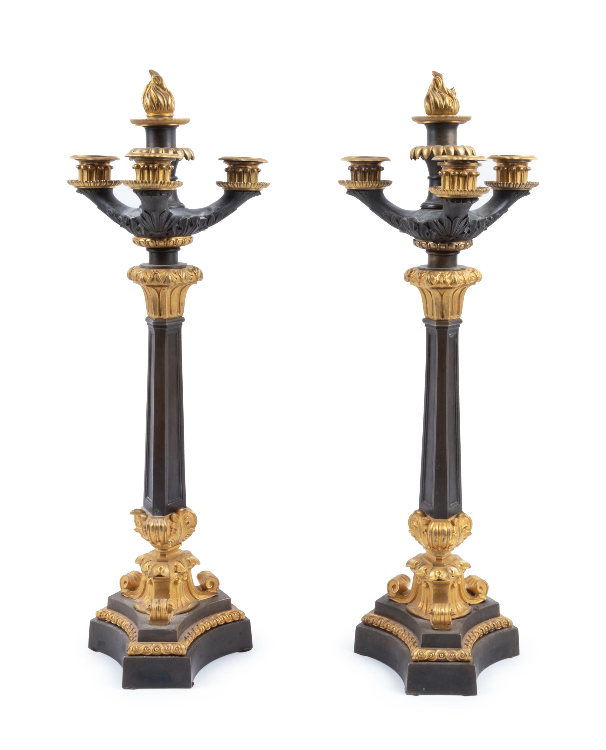 A Pair of Charles X Style Gilt and Patinated Bronze Four-Light Candelabra