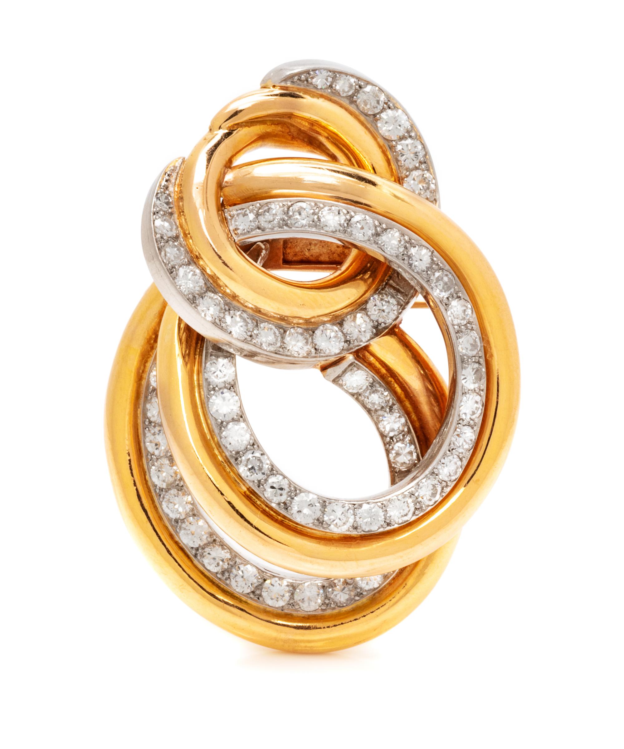 A Yellow Gold, Platinum and Diamond Swirl Brooch, 17.10 dwts.