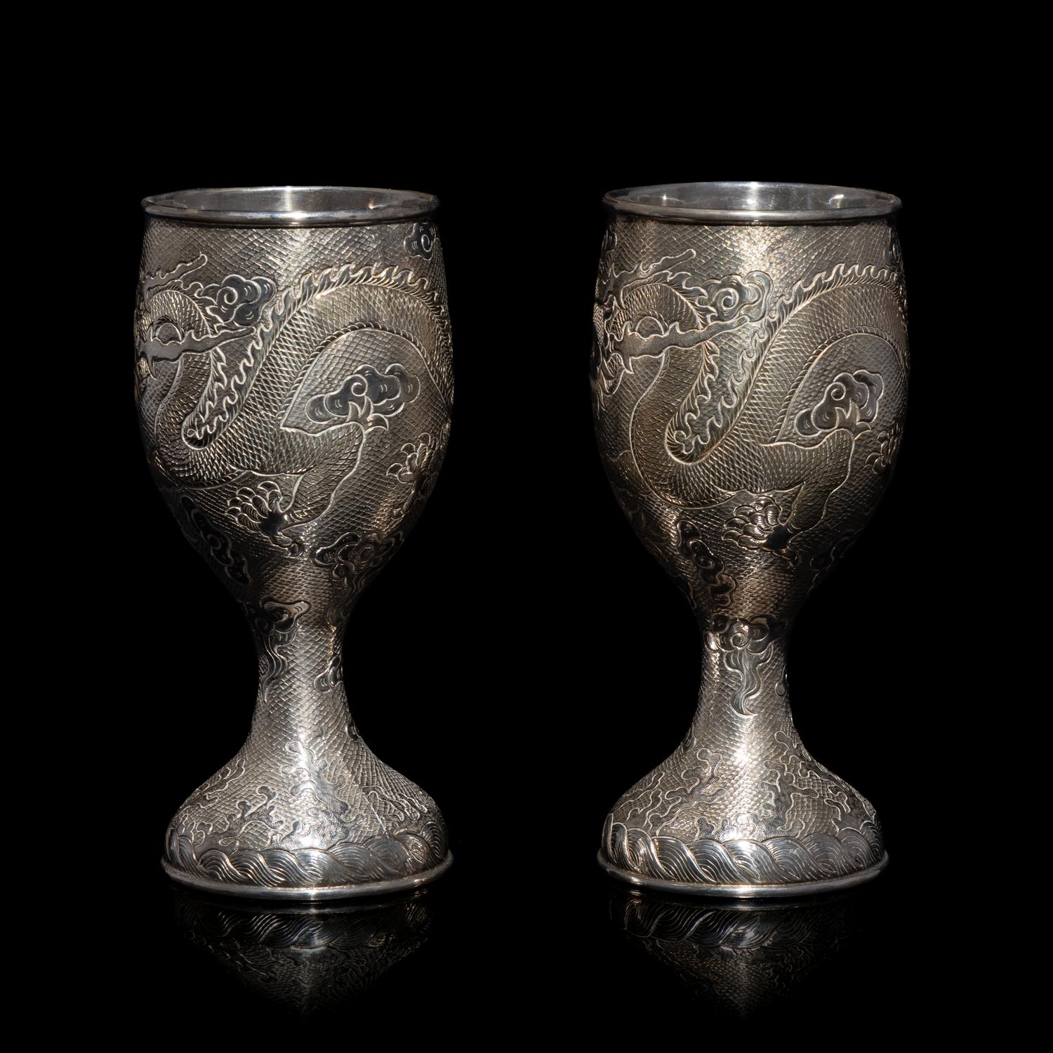 A Pair of Chinese Export Silver 'Dragon' Wine Cups, 20th Century 近代 外銷鏨云龍紋酒杯一對