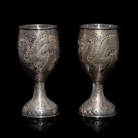A Pair of Chinese Export Silver 'Dragon' Wine Cups, 20th Century 近代 外銷鏨云龍紋酒杯一對