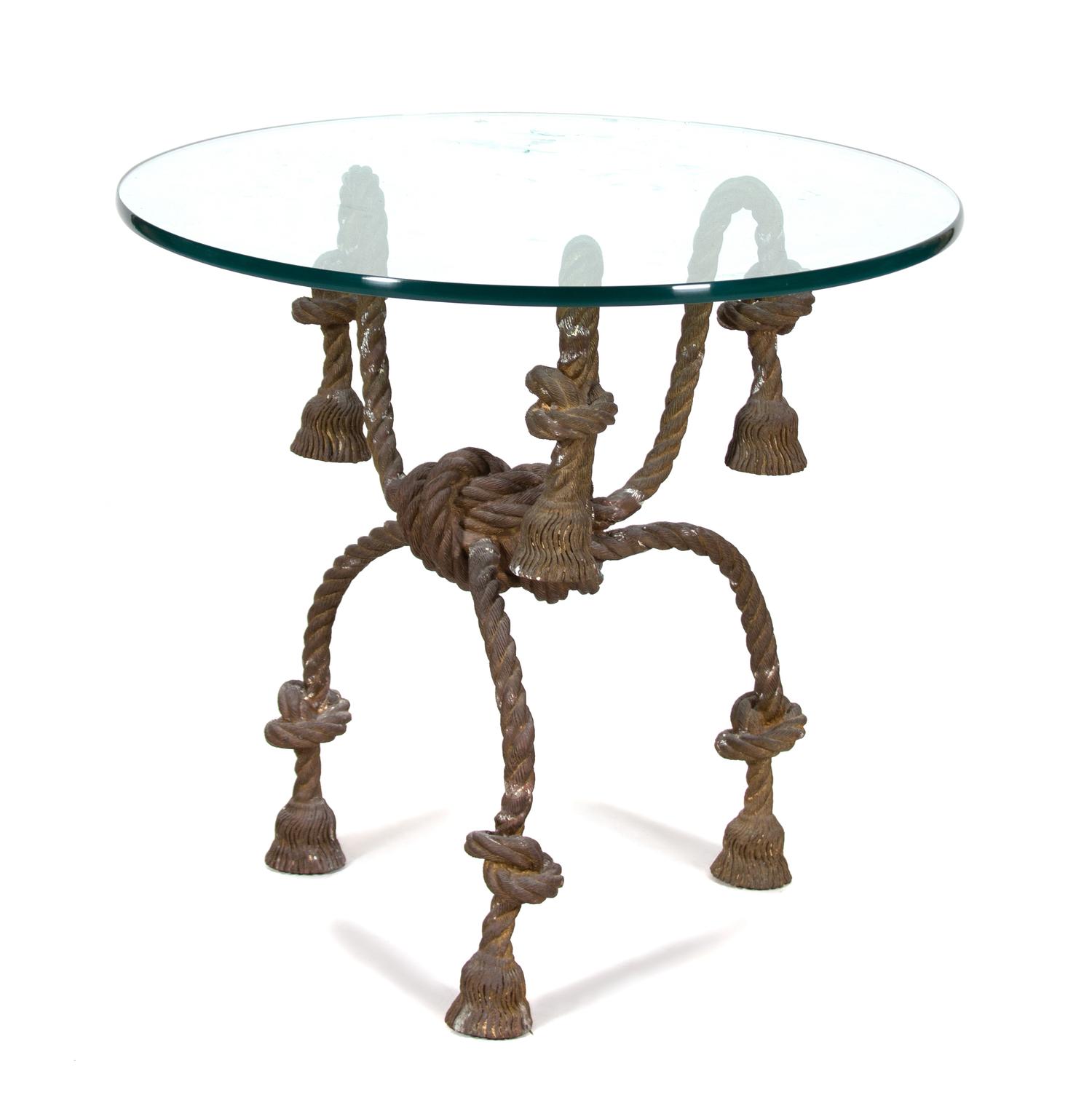 An Italian Gilt Metal Rope and Tassle Glass Top Table Height 29 1/2 x diameter 32 1/2 inches. — 20TH CENTURY