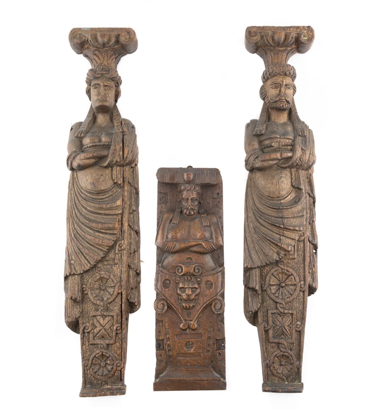 A Group of Three Carved Oak Figural Pilasters