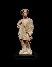A Greek Painted Terra Cotta Male Figure