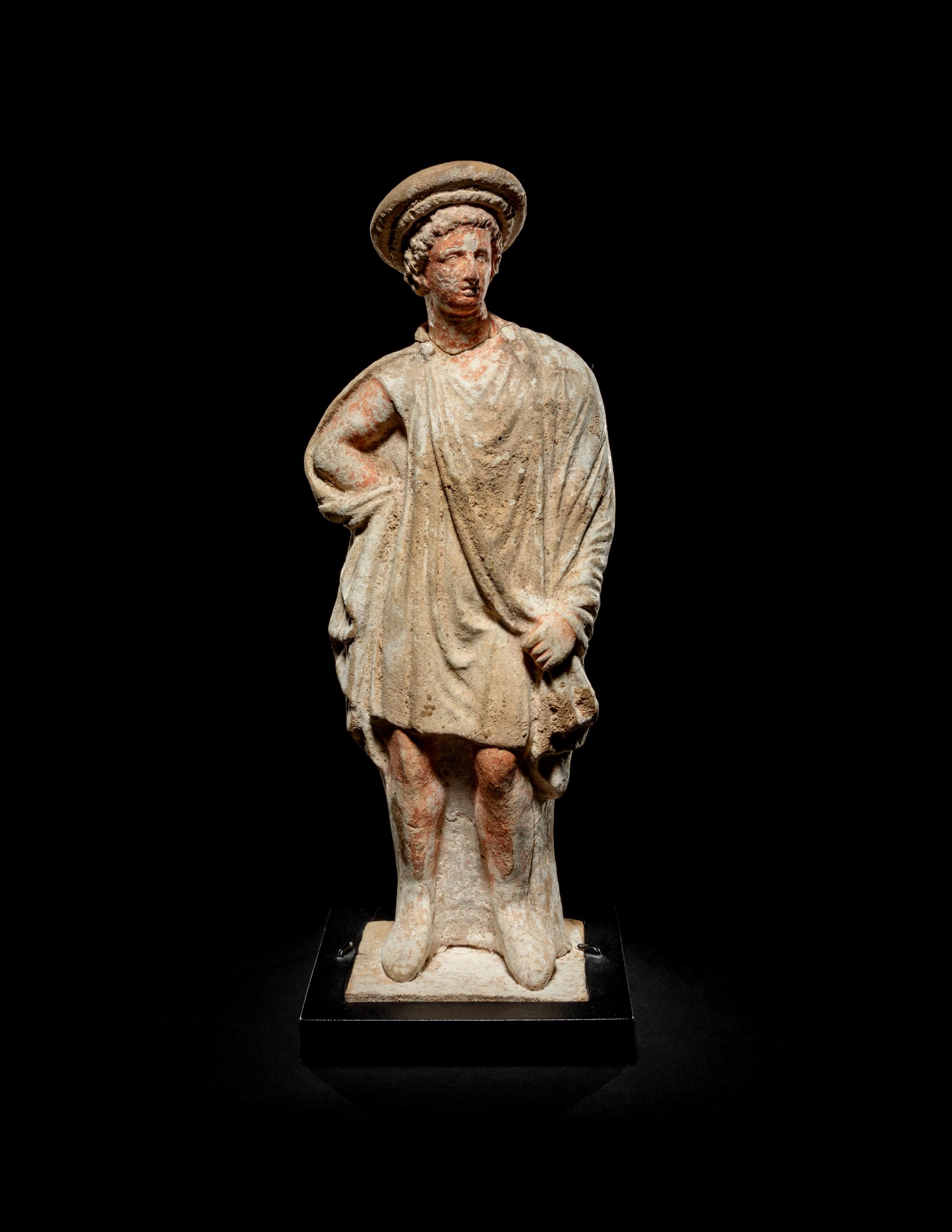A Greek Painted Terra Cotta Male Figure