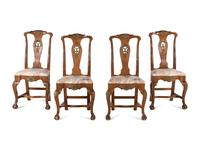 A Set of Four Dutch Parcel-Gilt Walnut Side Chairs