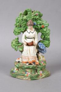 A Staffordshire Bocage Figural Group, Height 8 1/4 inches.