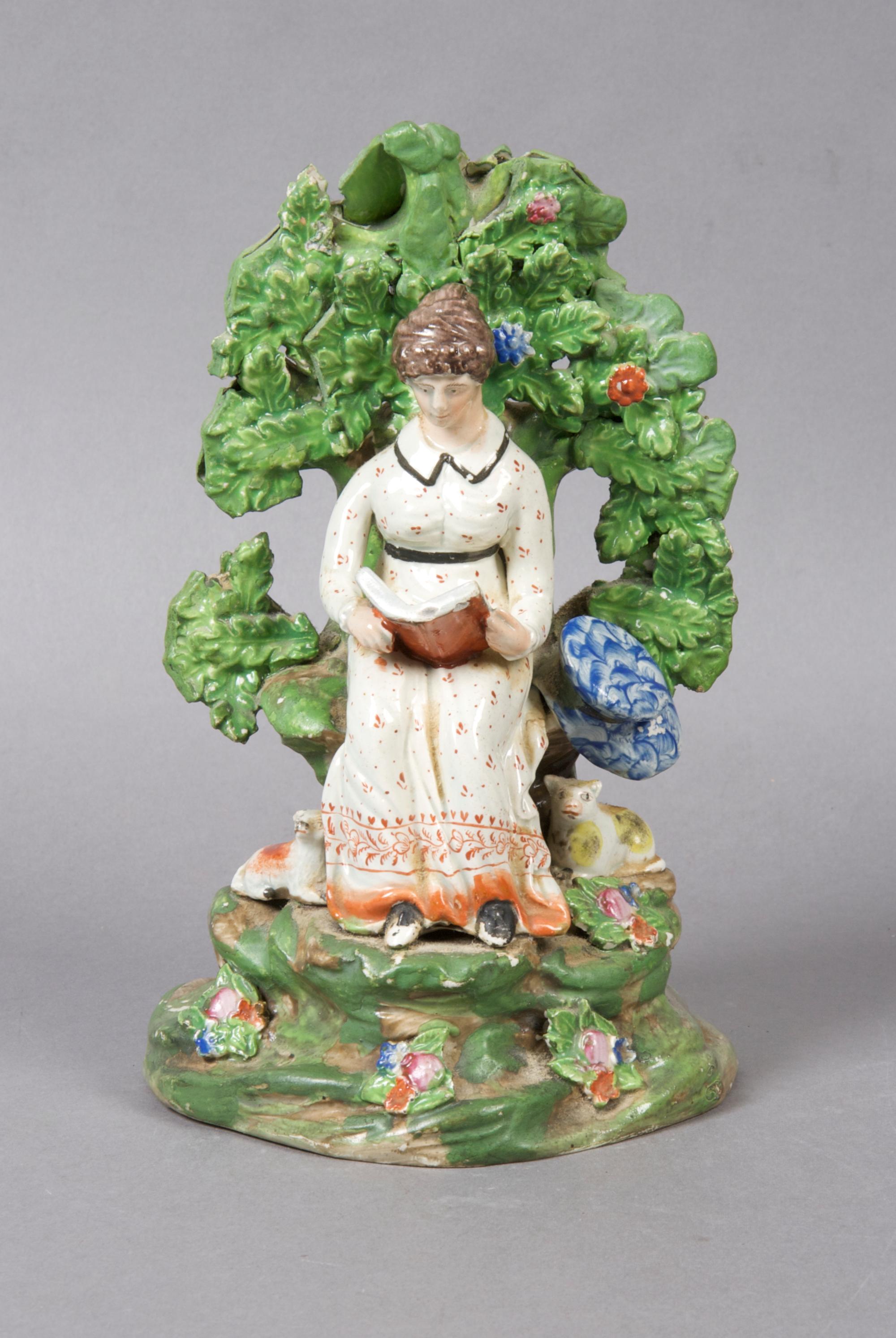 A Staffordshire Bocage Figural Group, Height 8 1/4 inches.