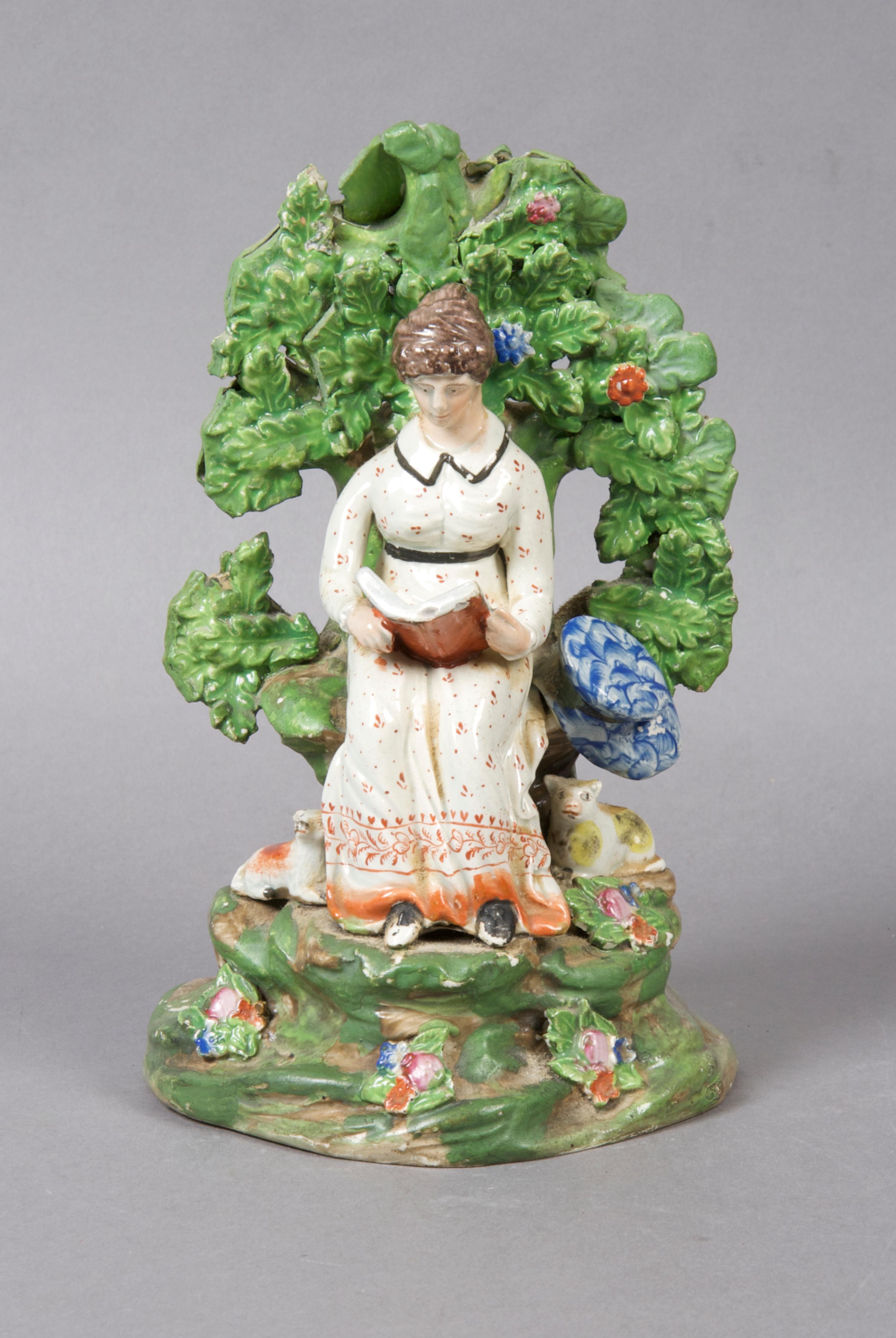 A Staffordshire Bocage Figural Group, Height 8 1/4 inches.