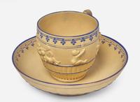A Wedgwood Encaustic Decorated Caneware "Bacchanalian Boys" Cup and Saucer, UK, circa 1790