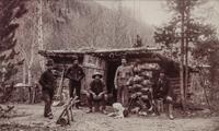 A group of three photographs (3647. Miners at Home; Untitled (main street); 2209. Dug Out - Bluer River Valley)