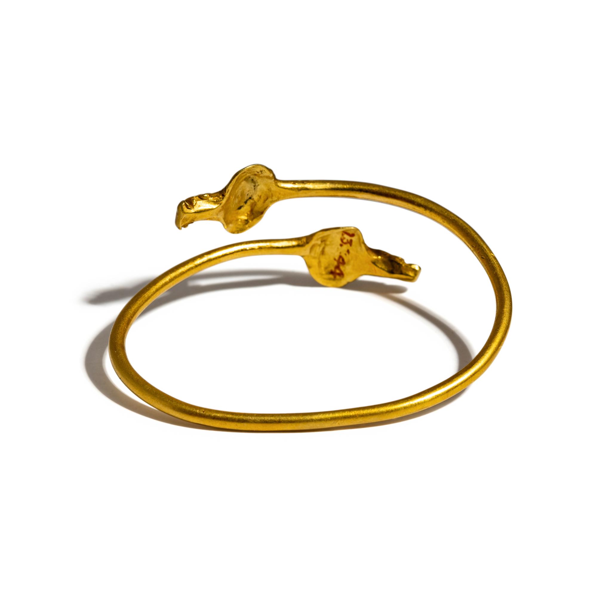 An Egyptian Gold Bracelet with Terminal Busts of the Goddess Isis