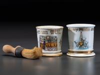 Two Retailer's Porcelain Occupational Shaving Mugs