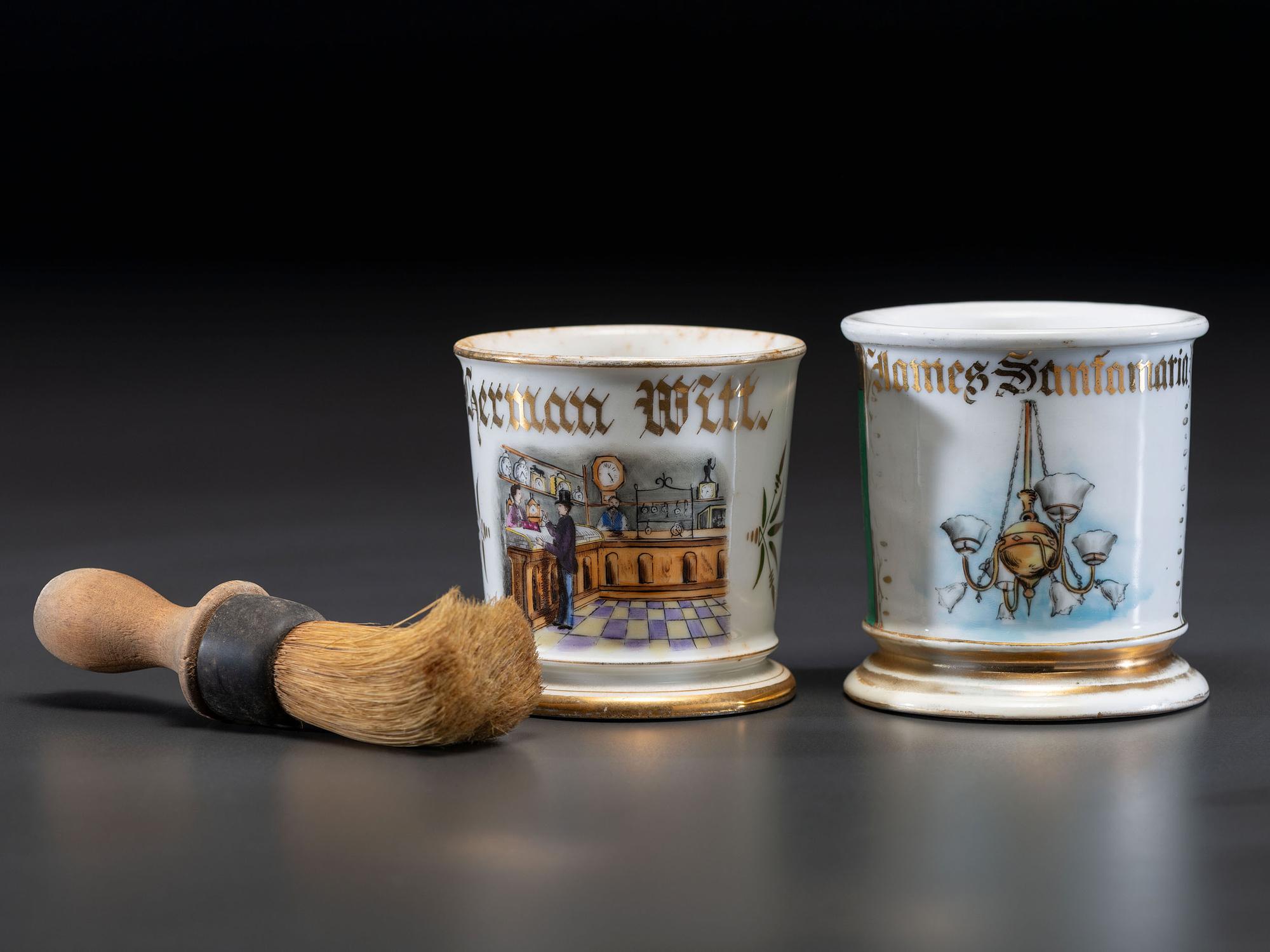 Two Retailer's Porcelain Occupational Shaving Mugs