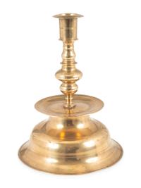 A Rare Continental Brass Bell-Bottom Candlestick