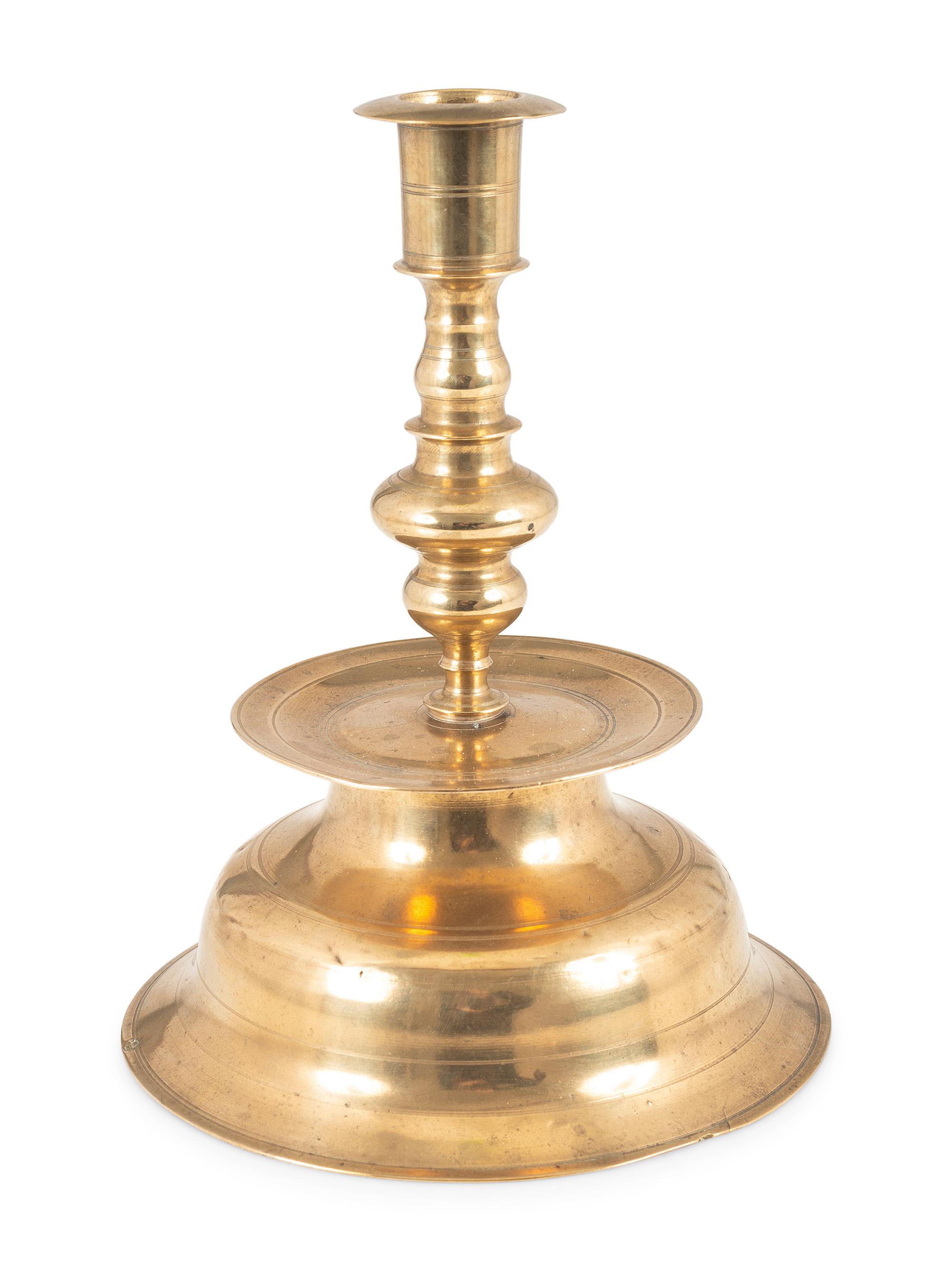 A Rare Continental Brass Bell-Bottom Candlestick