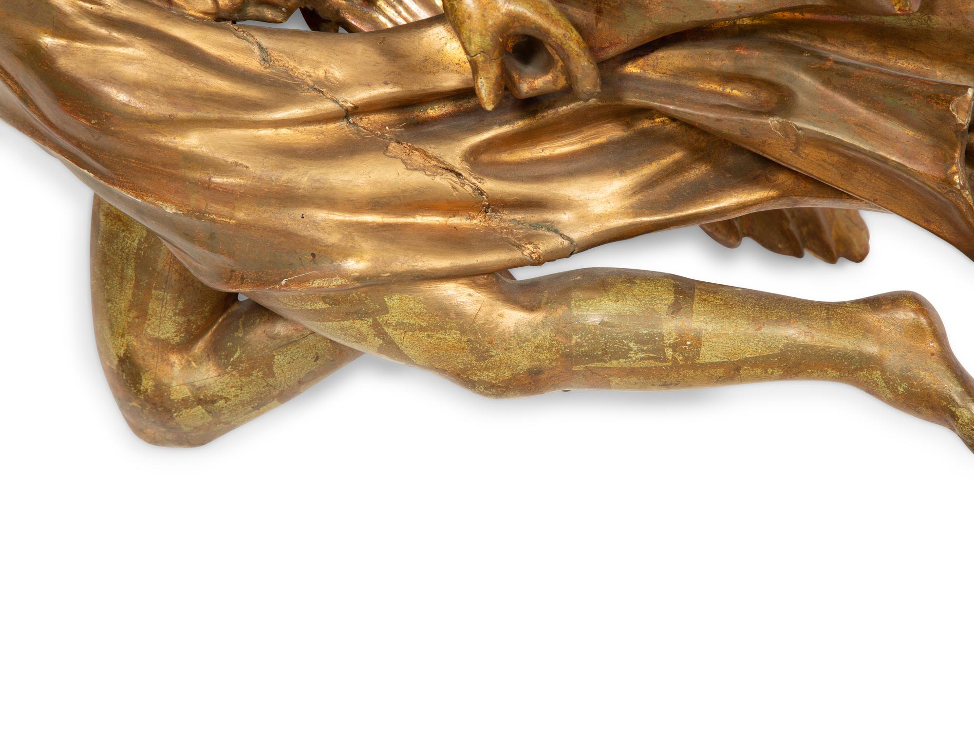 A Pair of Italian Carved Giltwood Winged Angel Appliqués