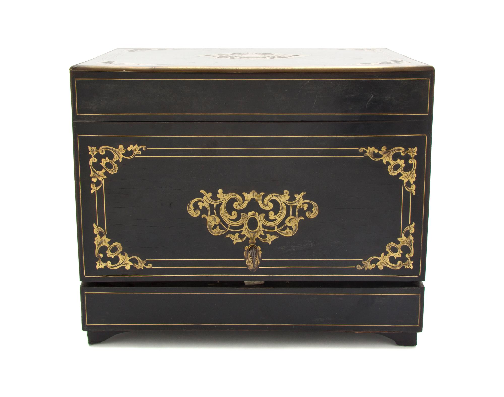 A Continental Ebonized and Brass Inlaid Cave a Liqueur, Height of case 10 3/8 x width 12 3/8 x depth 9 1/2 inches.