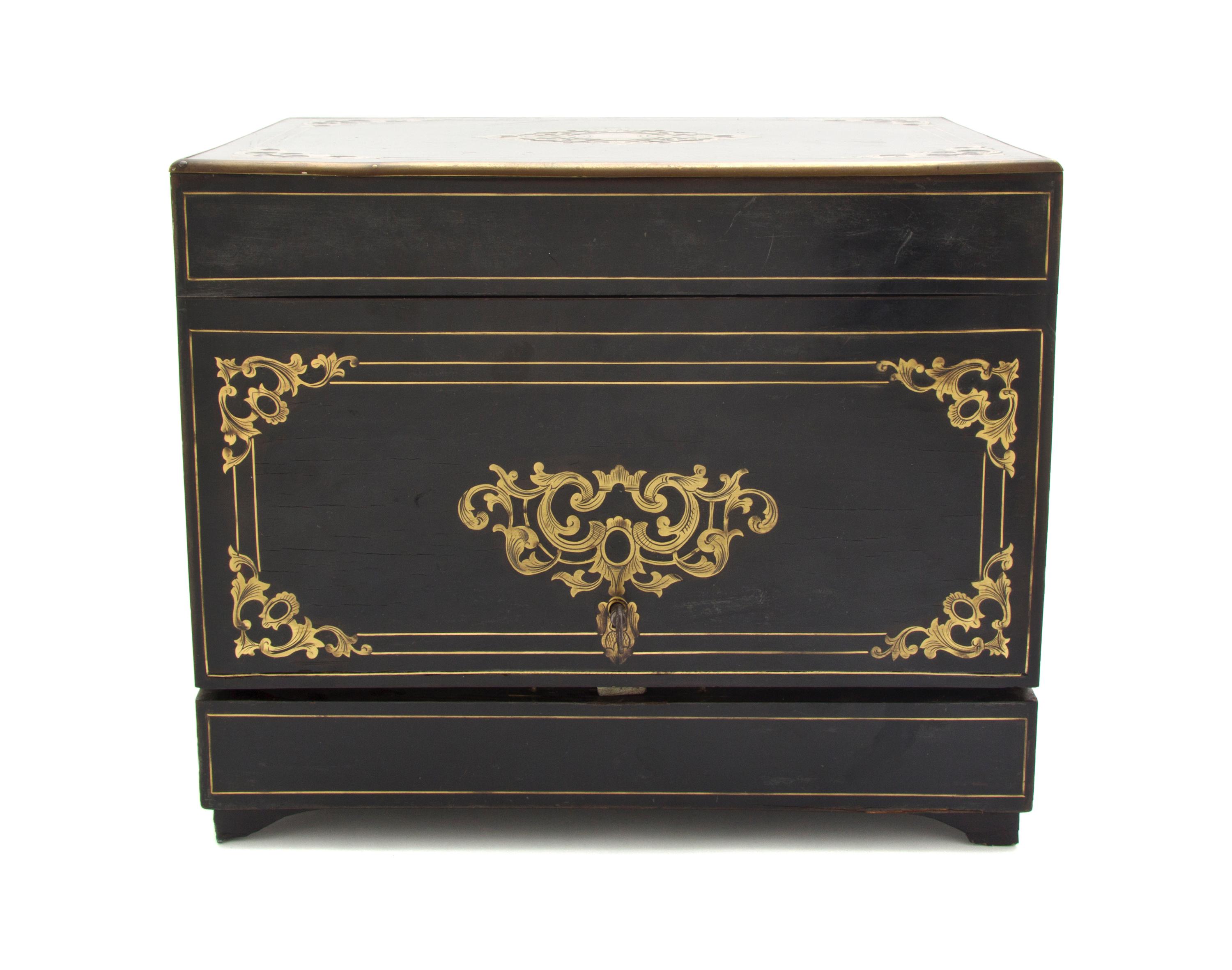 A Continental Ebonized and Brass Inlaid Cave a Liqueur, Height of case 10 3/8 x width 12 3/8 x depth 9 1/2 inches.