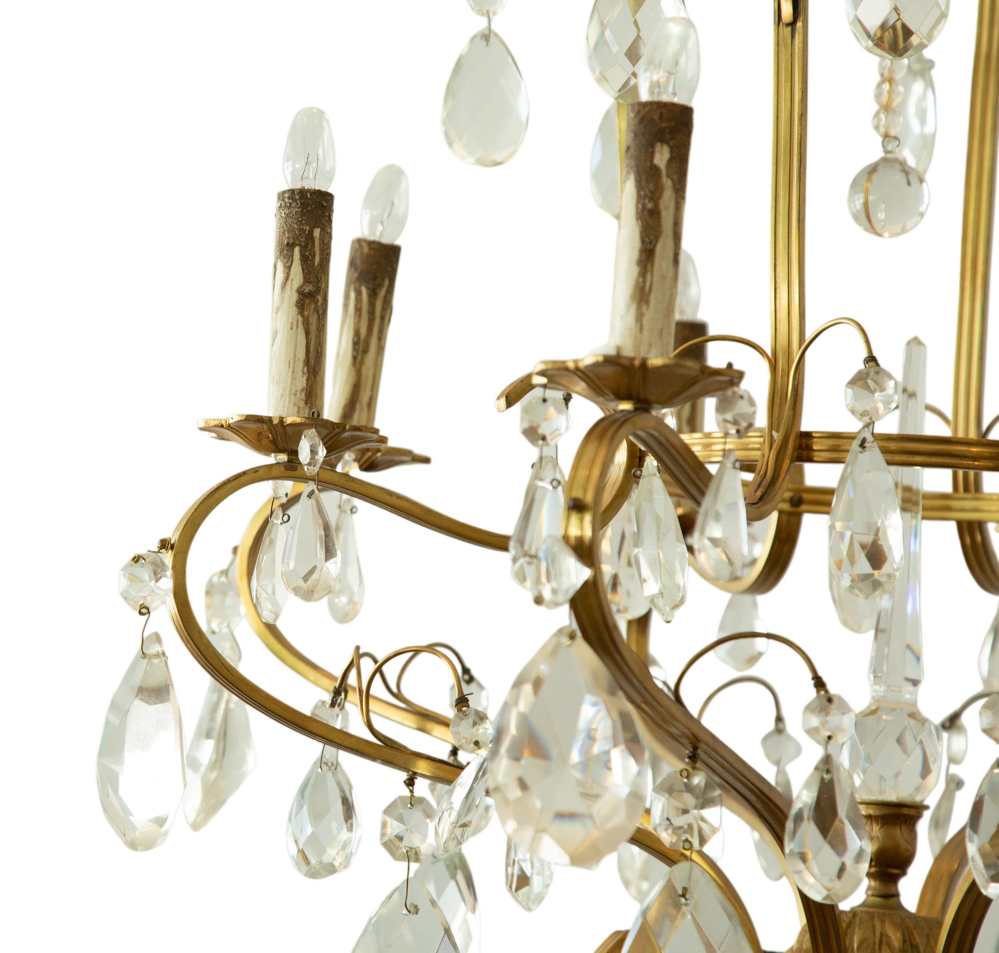 A Louis XV Style Gilt Metal and Cut Glass Six-Light Chandelier