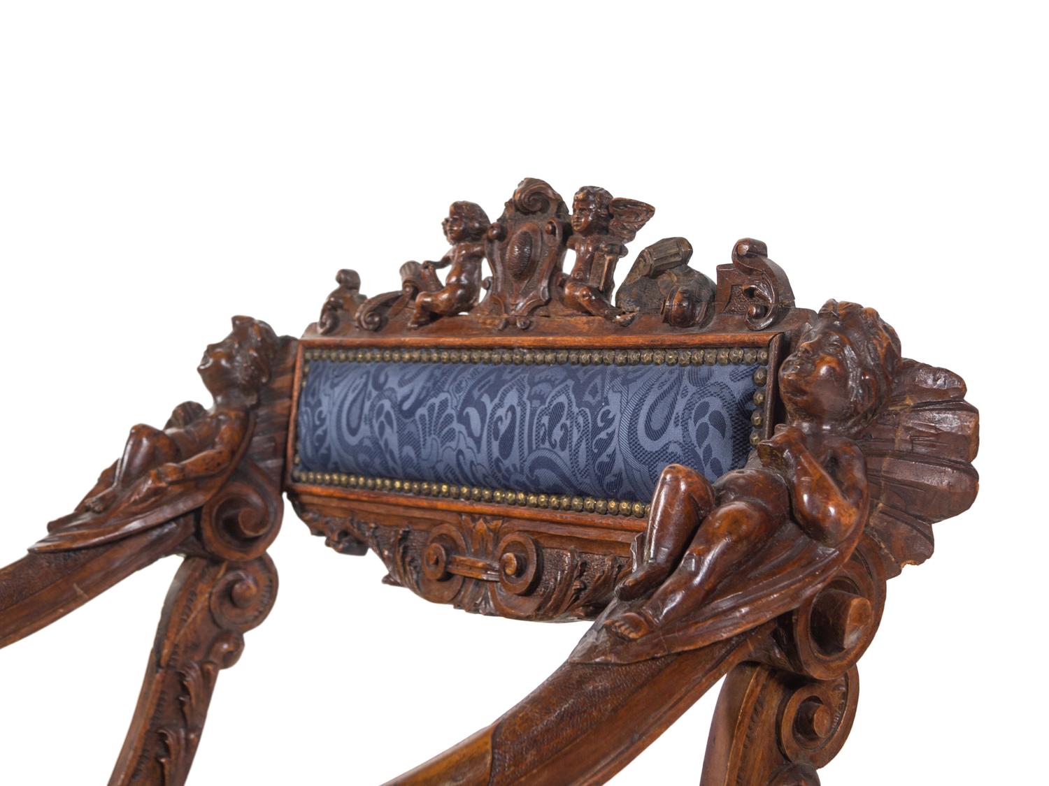 A Pair of Italian Renaissance Style Carved Walnut Armchairs