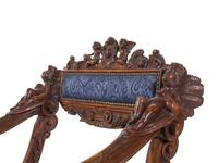A Pair of Italian Renaissance Style Carved Walnut Armchairs