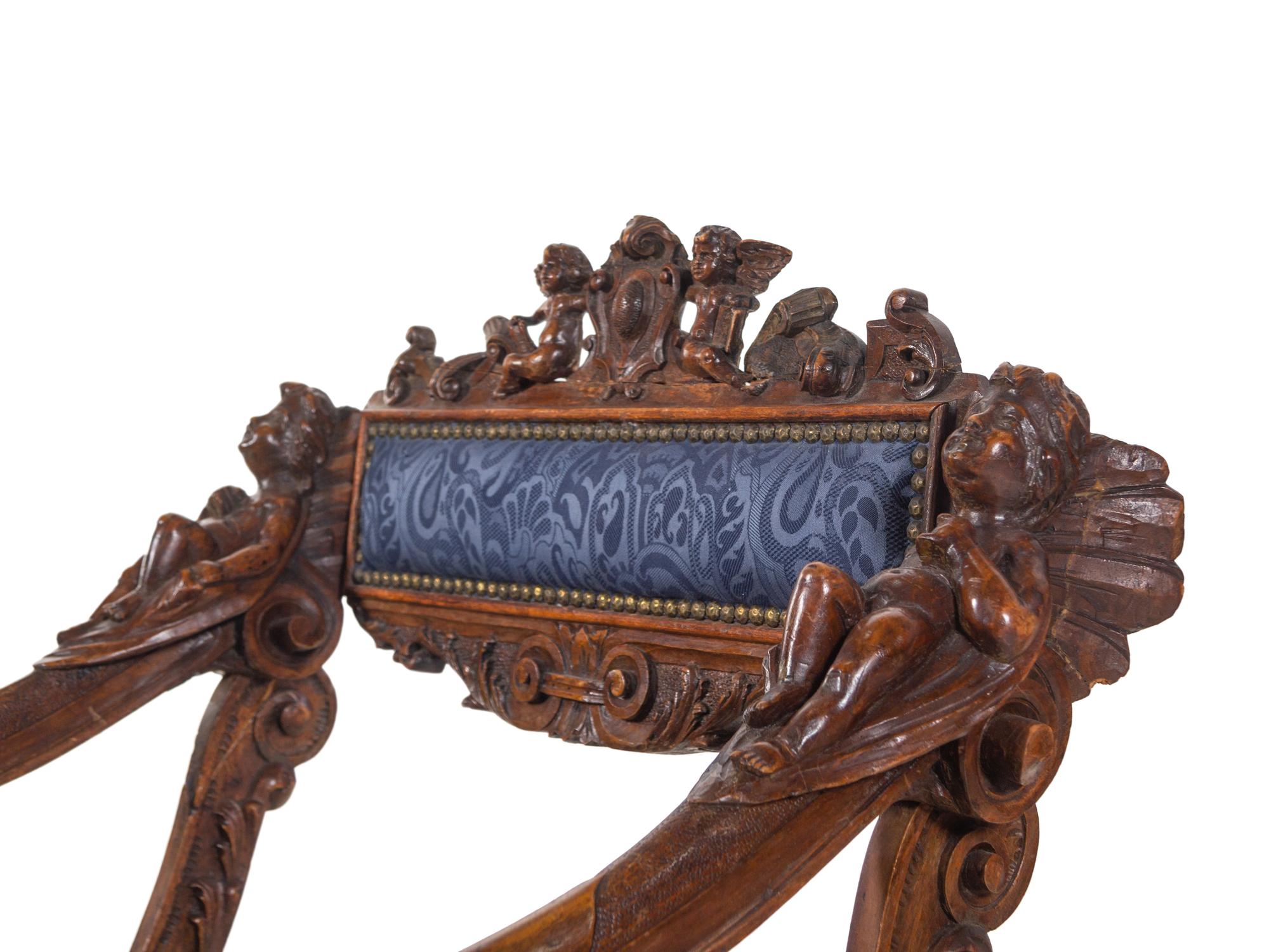 A Pair of Italian Renaissance Style Carved Walnut Armchairs