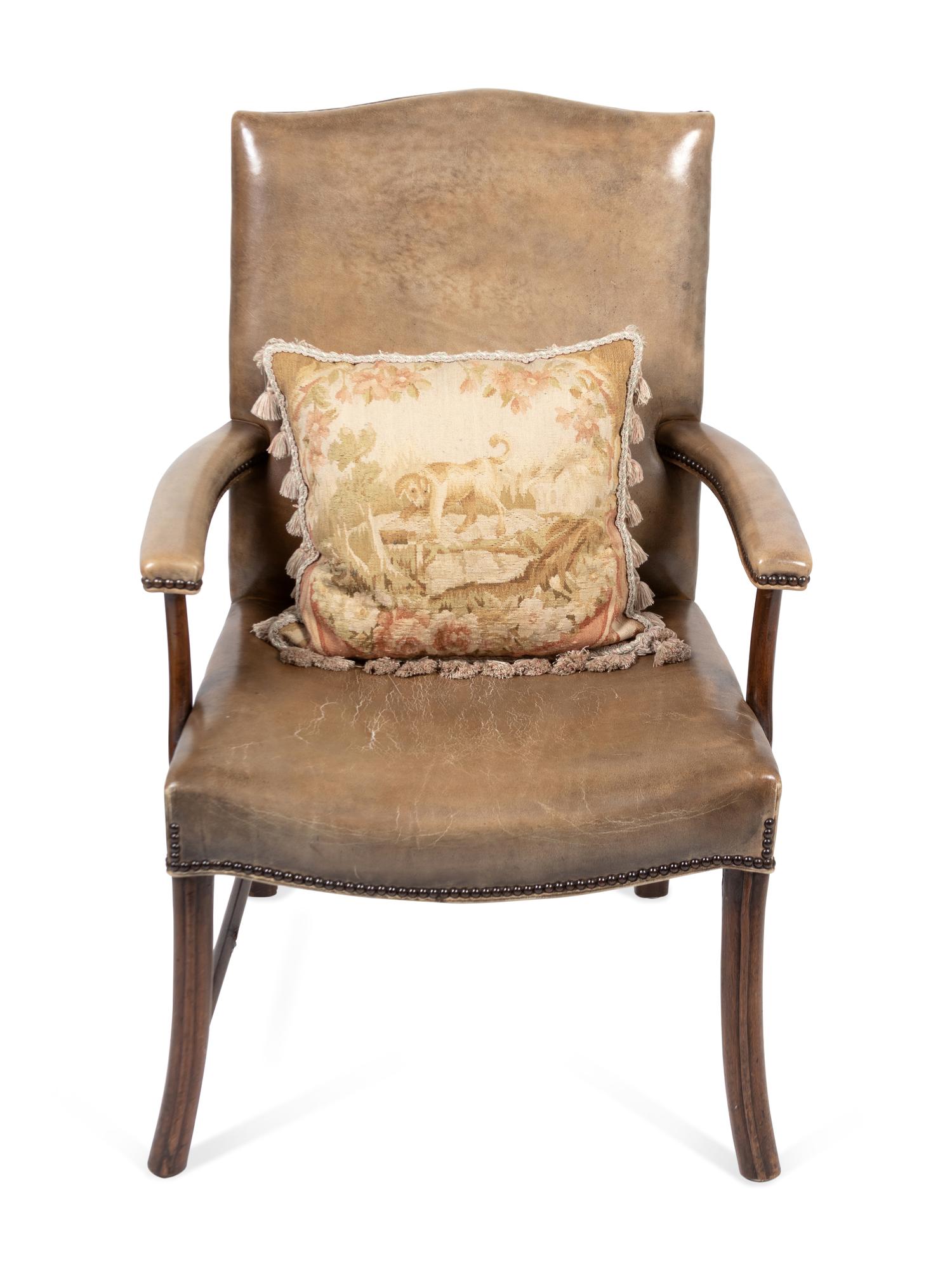 An Edwardian Mahogany Leather Upholstered Library Chair with Needlepoint Pillow