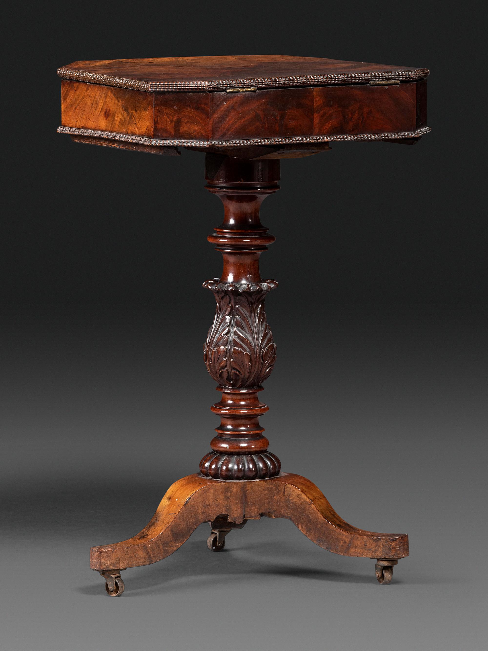 A Classical Carved and Figured Mahogany Work Table