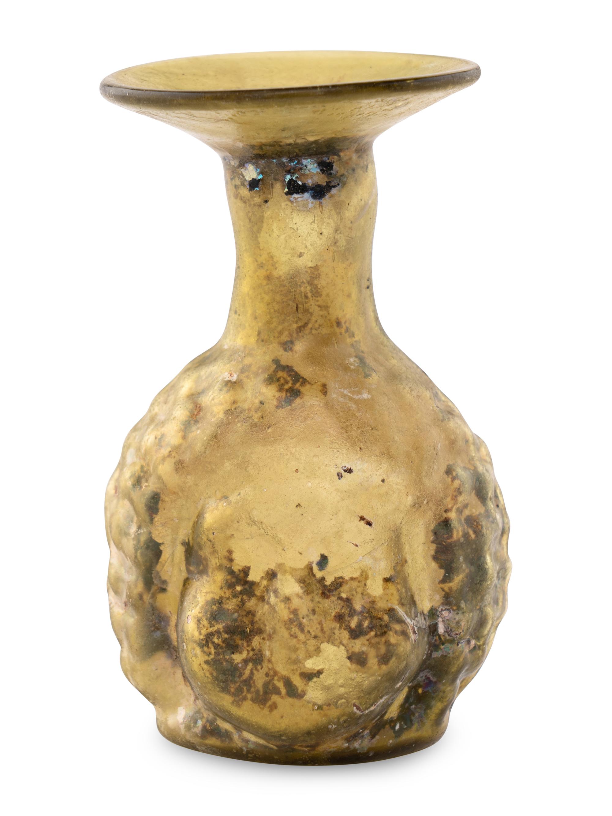 A Roman Glass Janus Head Flask