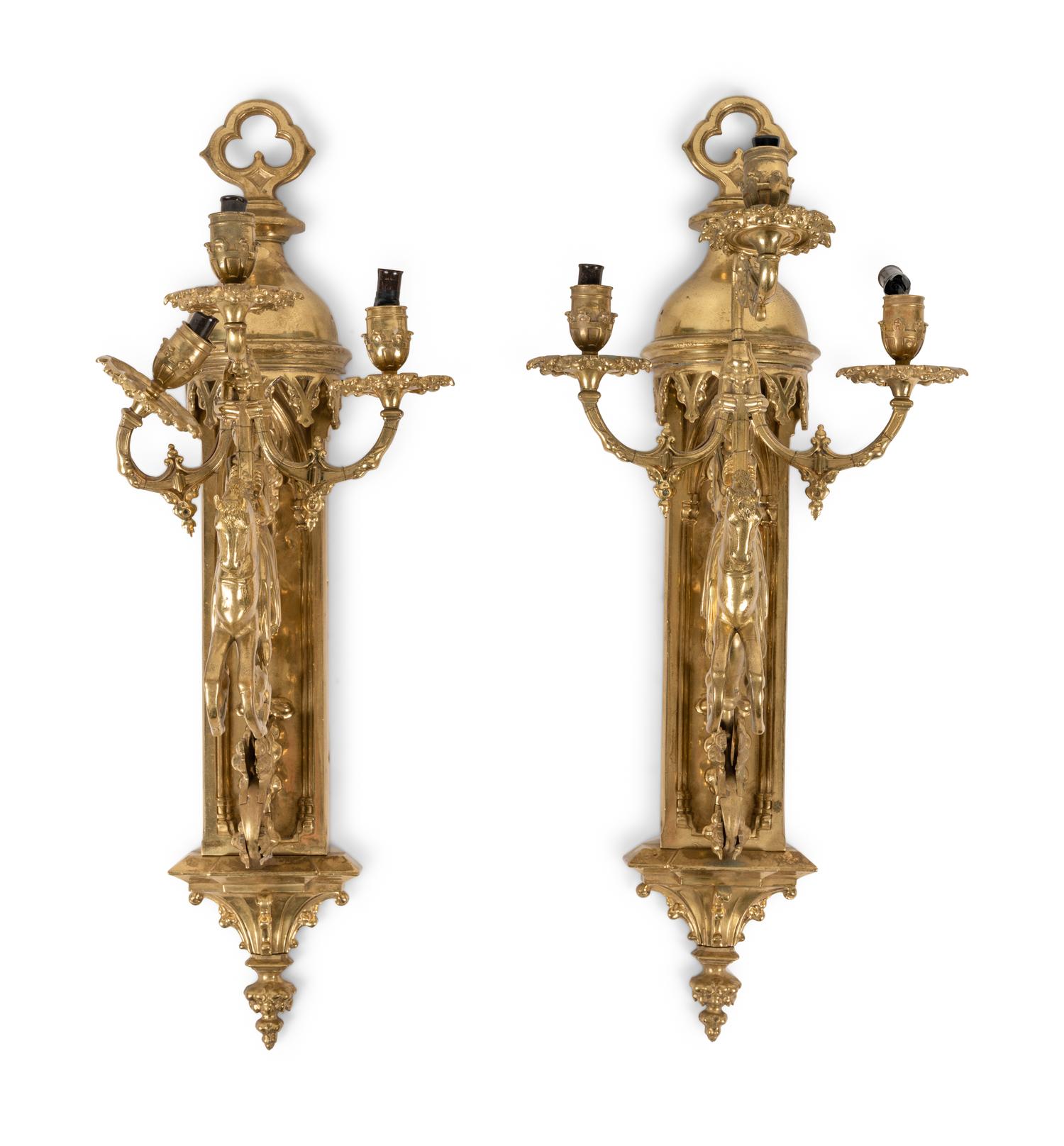 A Pair of Gothic Style Brass Three-Light Sconces
