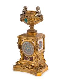 A French Gilt and Silvered Bronze Mounted Specimen Marble Mantel Clock