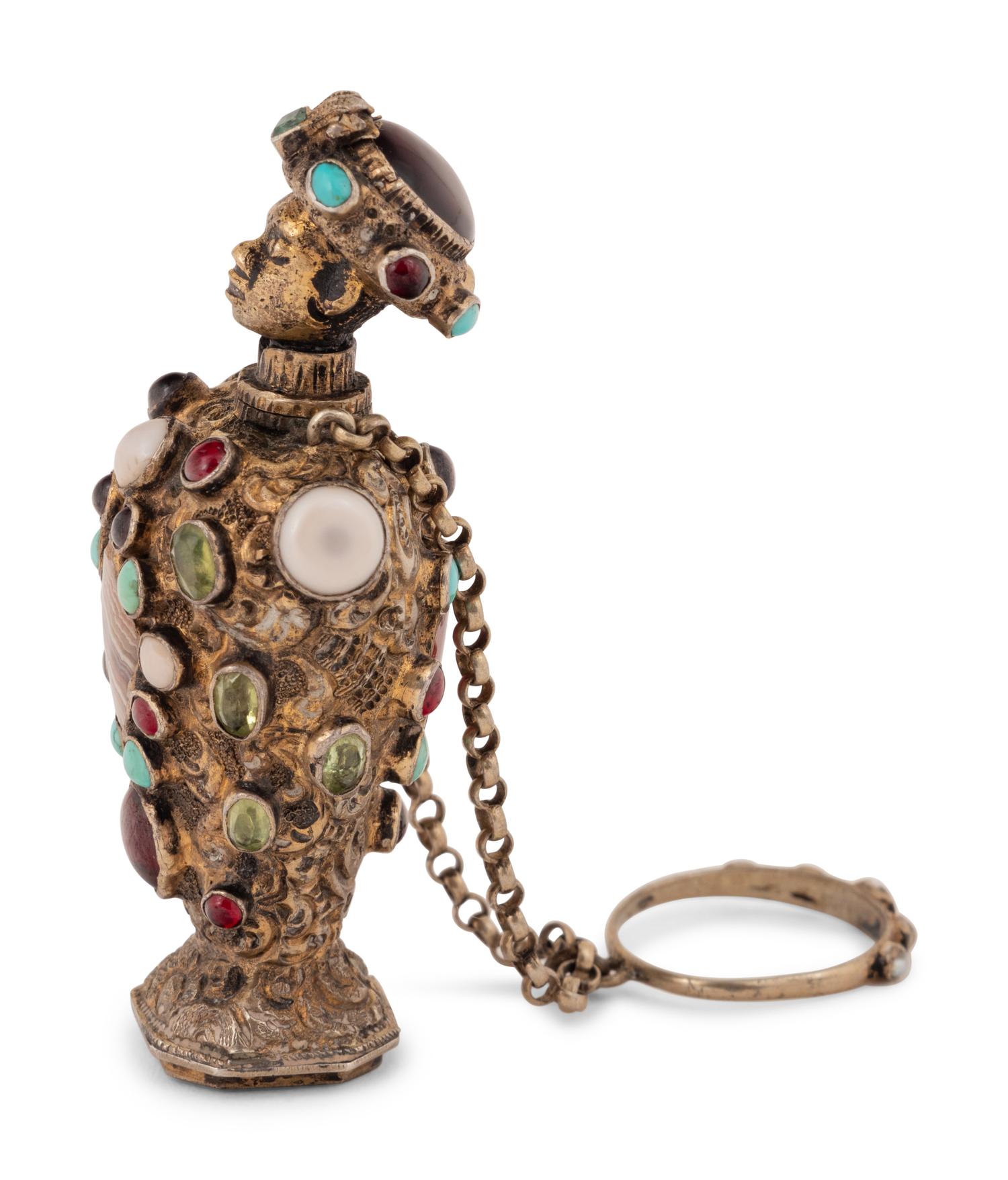 A Continental Jeweled Silver Figural Scent Bottle and Hand Seal