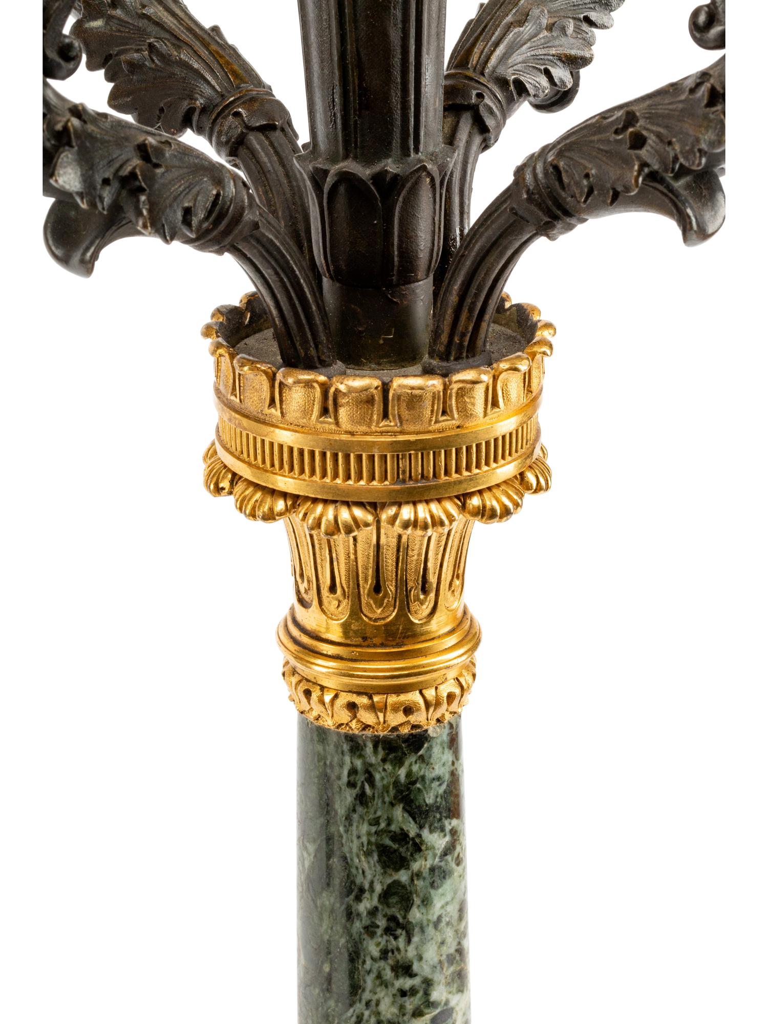 A Pair of Empire Style Gilt and Patinated Bronze and Marble Five-Light Candelabra