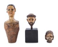 A Carved and Polychrome Painted Santos Heads