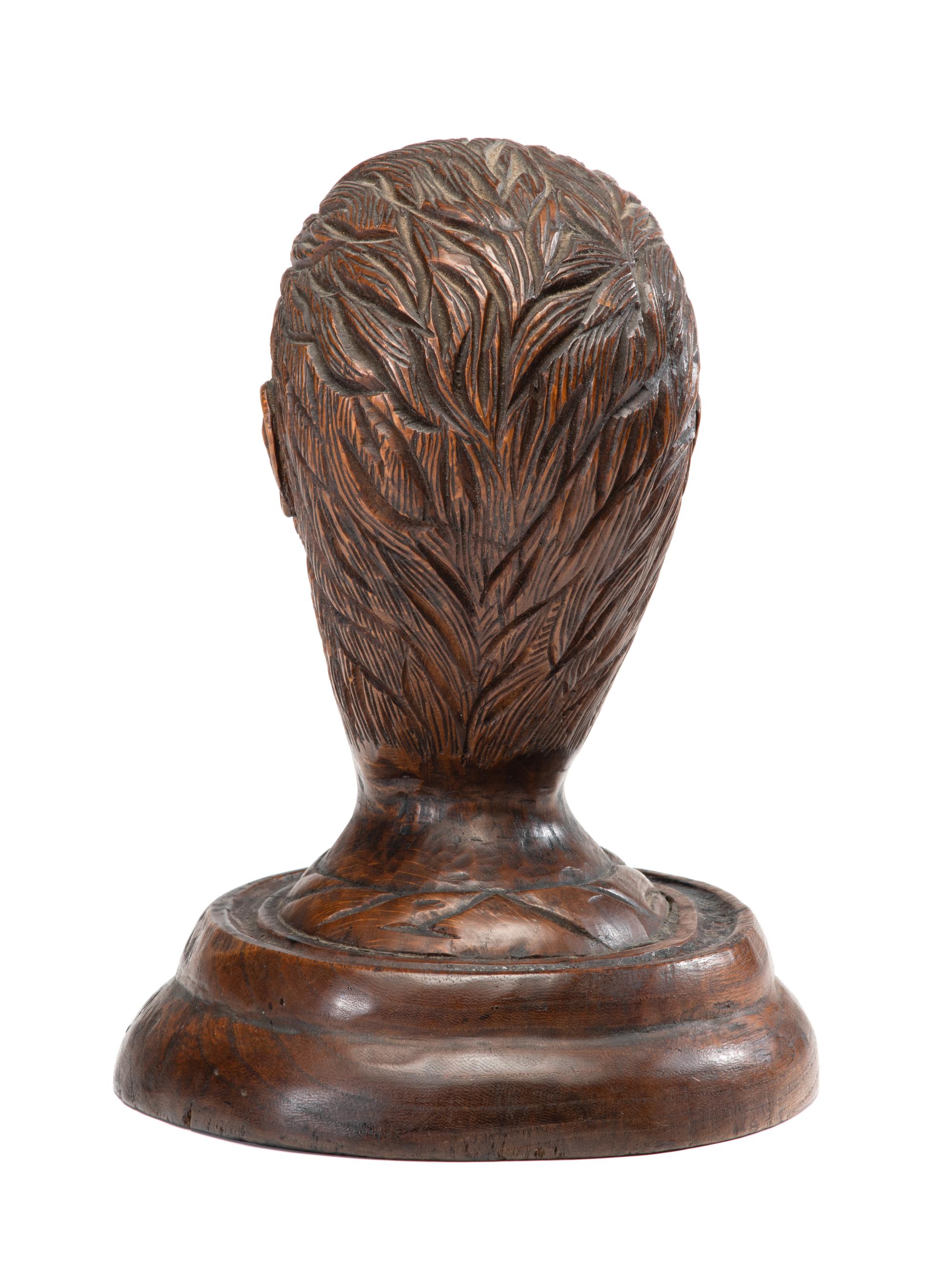 A Carved Wood Portrait Head