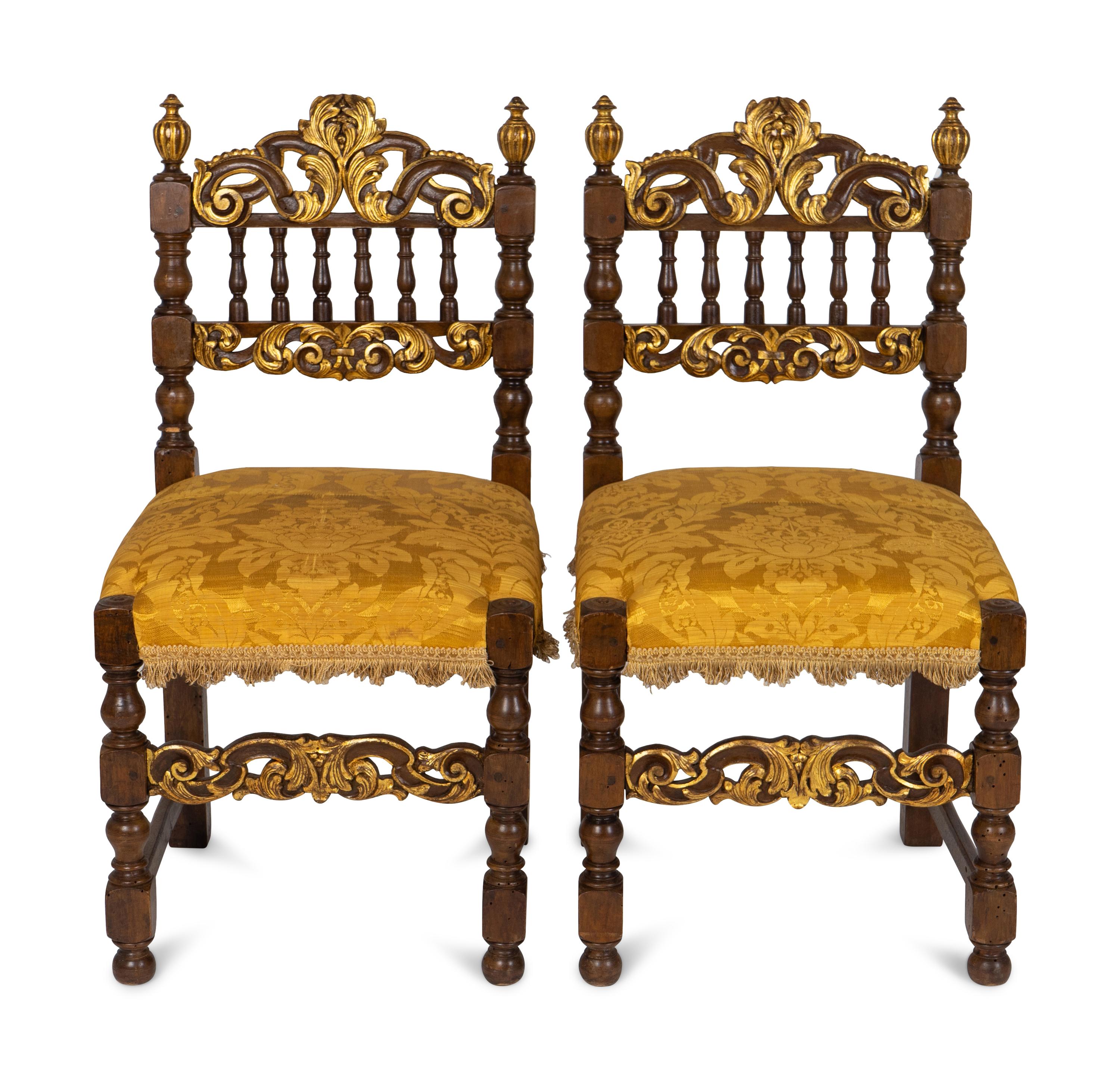A Pair of Spanish Baroque Style Parcel-Gilt Walnut Slipper Chairs
