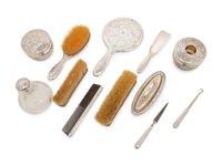 A Tiffany and Co. Silver-Mounted Twelve-Piece Dresser Set