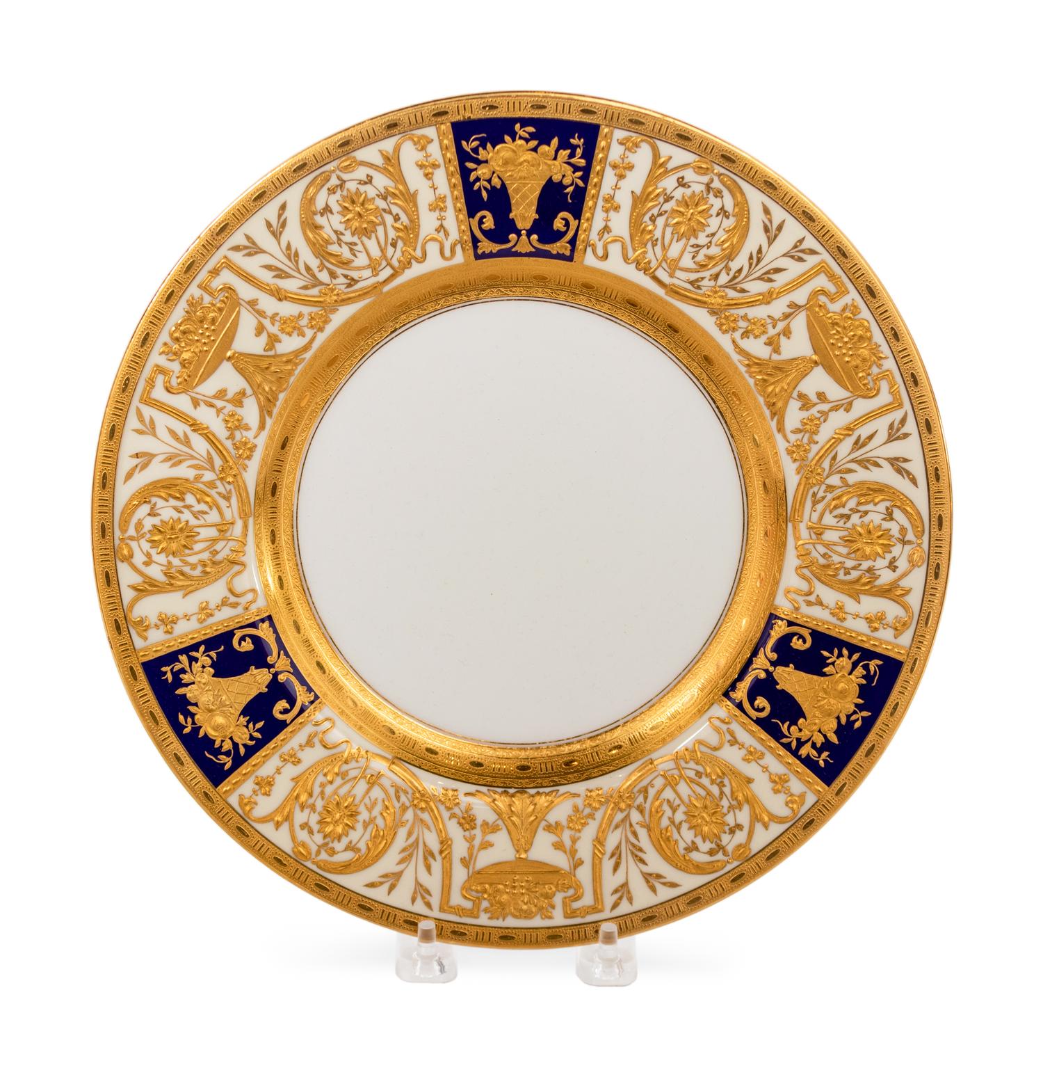 A Set of Twelve Gilt-Decorated Porcelain Service Plates