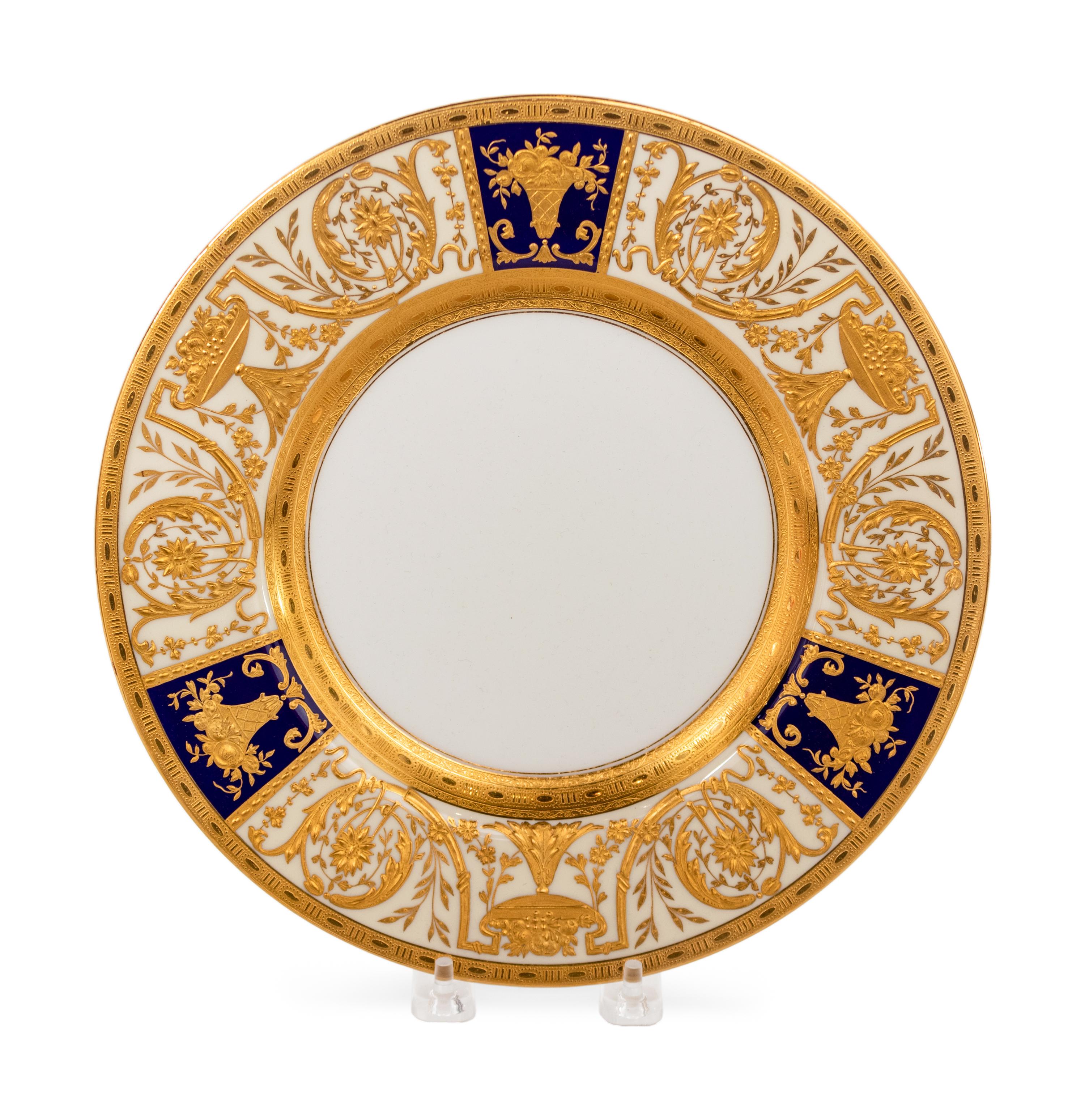 A Set of Twelve Gilt-Decorated Porcelain Service Plates