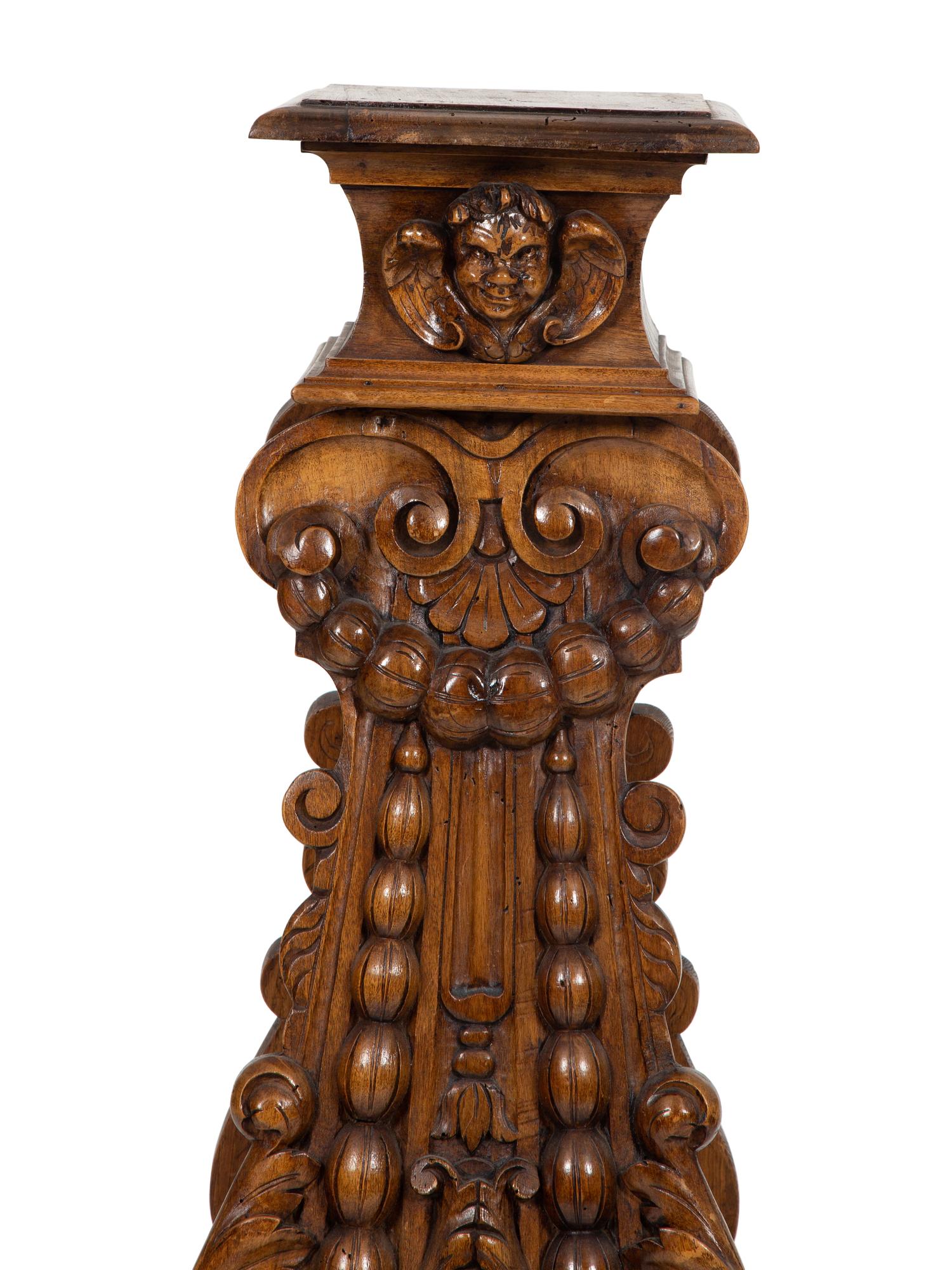 An Italian Renaissance Revival Carved Oak Sgabello Pedestal