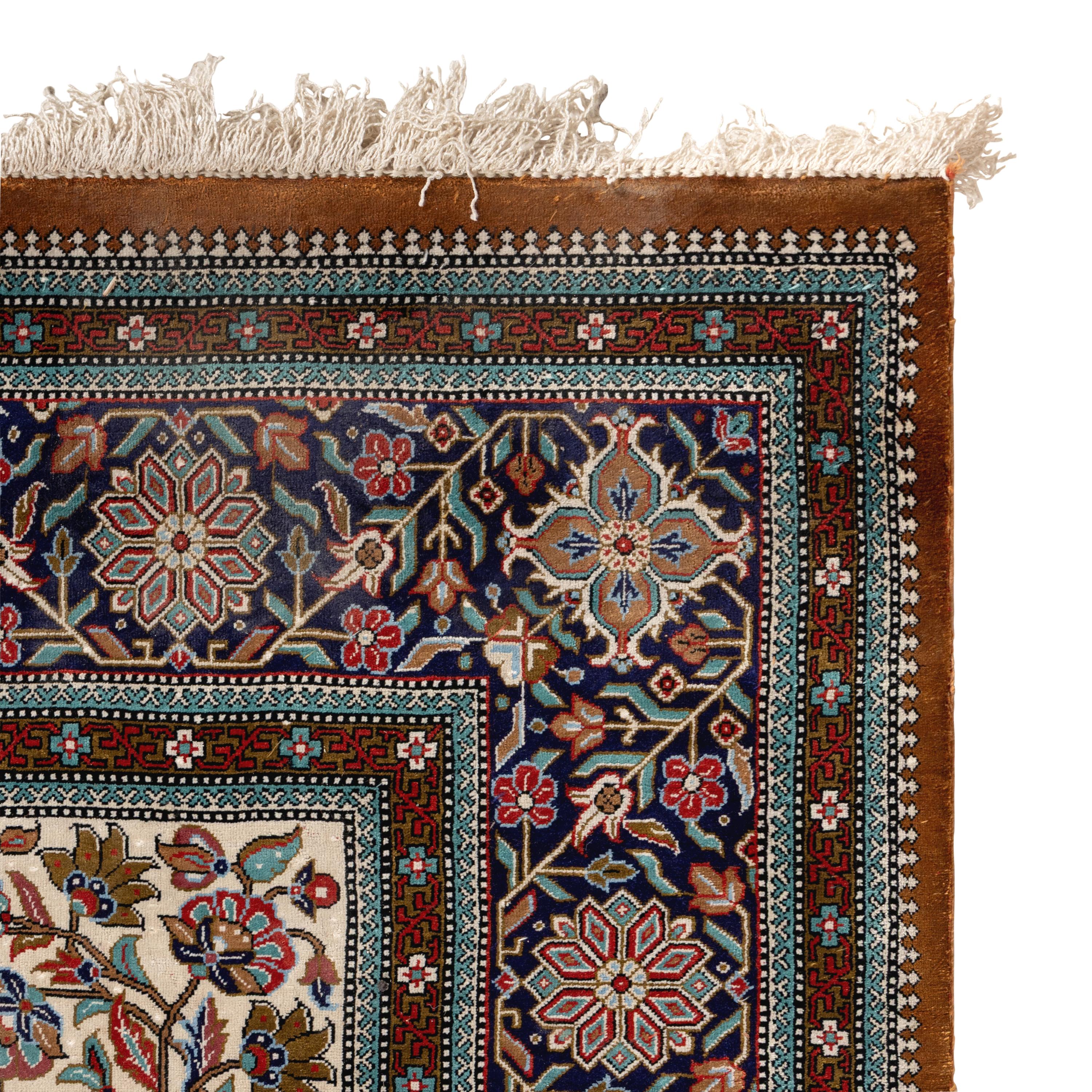 An Indian or Qom Silk Rug