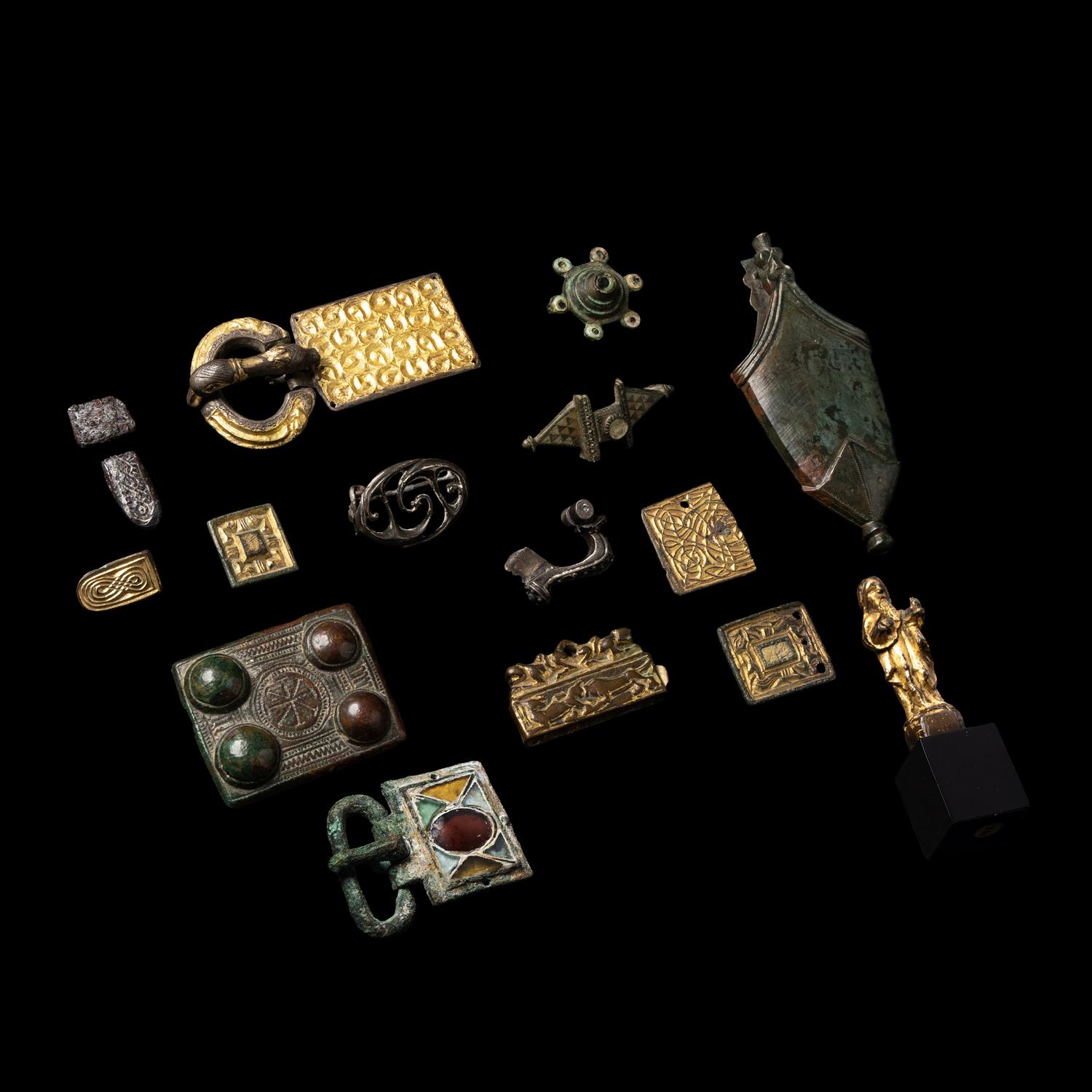 Fifteen Roman and Migration Period Fragmentary Gold, Silver, Enamel and Bronze Fibulae, Fittings, and a Chape