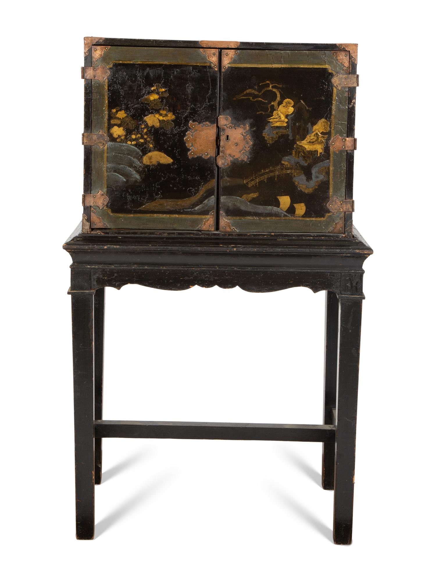 A Chinese Black and Gilt Lacquered Cabinet on Stand